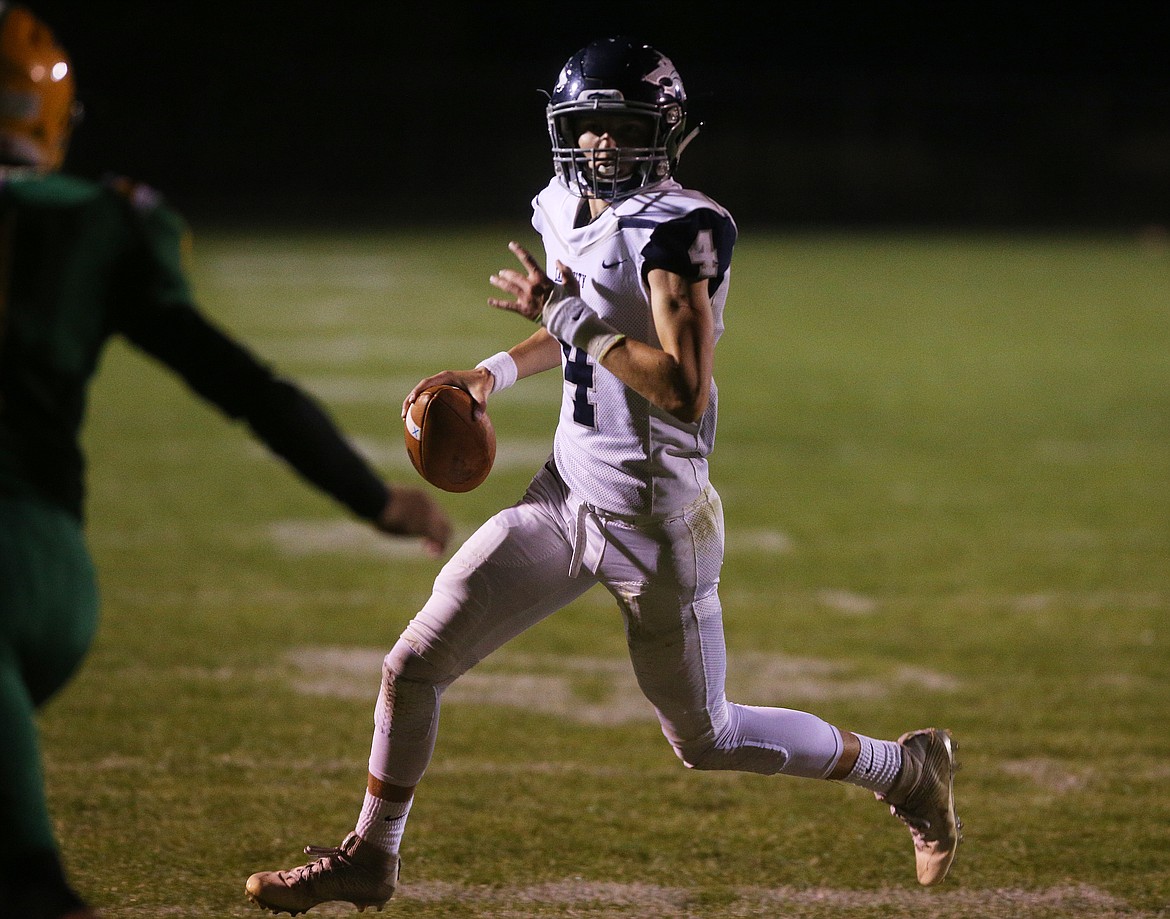 Lake City quarterback Chris Irvin rolls out in Friday night&#146;s game against Lakeland.
