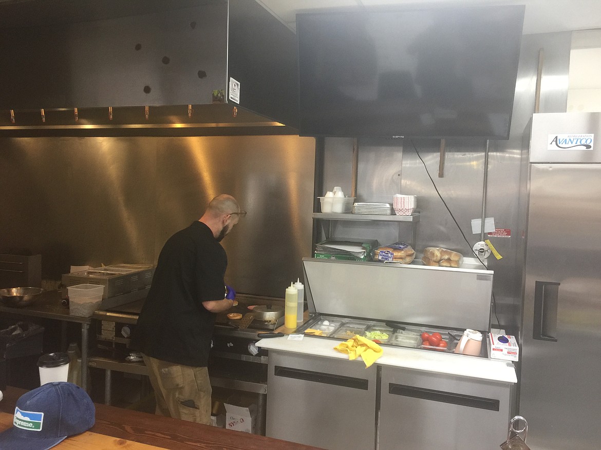 Courtesy photo
Chef David O&#146;Neill works the grill at Rex&#146;s Burgers, on the southwest corner of Appleway and Fourth Street in Coeur d&#146;Alene.