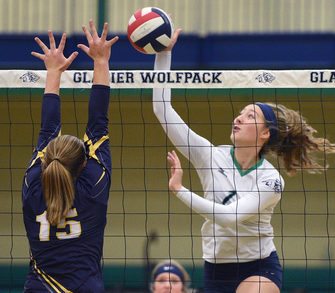 Glacier&#146;s Emma Anderson (14) goes for a kill against Missoula Big Sky&#146;s Bethanie Hicks (15) at Glacier High School on Saturday. (Casey Kreider/Daily Inter Lake)