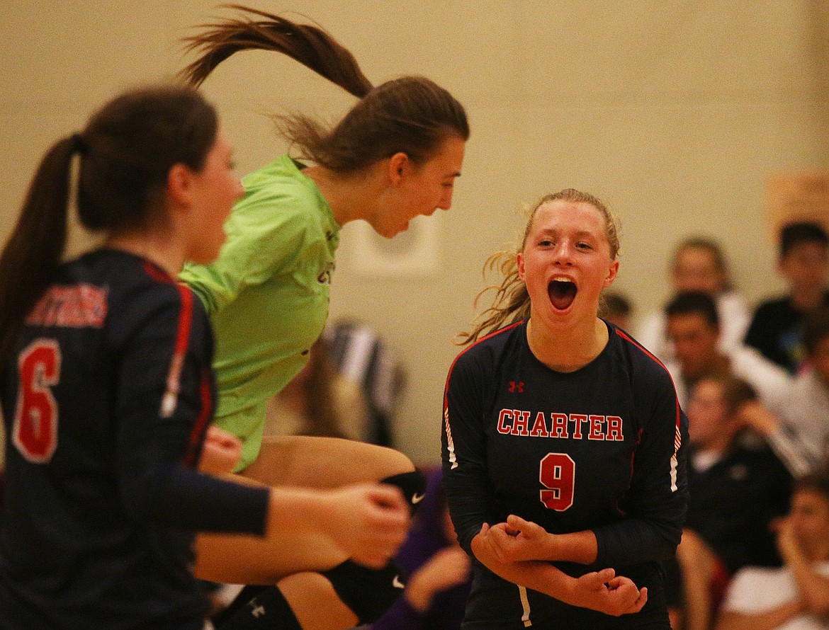 Coeur d&#146;Alene Charter&#146;s Madeline Kociela (9) celebrates a point in Tuesday night&#146;s match against Timberlake at Holy Family Catholic School. (LOREN BENOIT/Press)