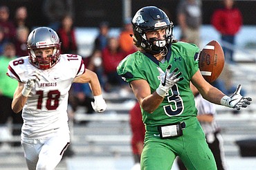 Glacier wide receiver Danny Anderson (3) hauls in a long touchdown reception in the second quarter in front of Helena defender Cooper Biegler (18) at Legends Stadium on Friday. (Casey Kreider/Daily Inter Lake)