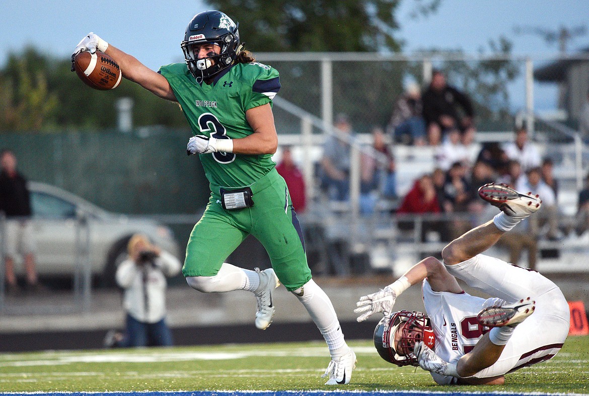 Glacier wide receiver Danny Anderson (3) sheds a tackle by Helena&#146;s Cooper Biegler (18) on a long touchdown reception in the second quarter at Legends Stadium on Friday. (Casey Kreider/Daily Inter Lake)