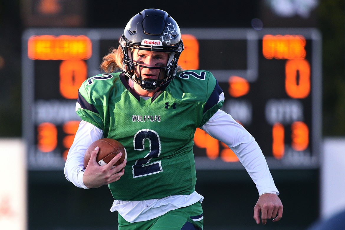 Glacier quarterback Evan Todd (2) scrambles for a gain in the first quarter against Helena at Legends Stadium on Friday. (Casey Kreider/Daily Inter Lake)