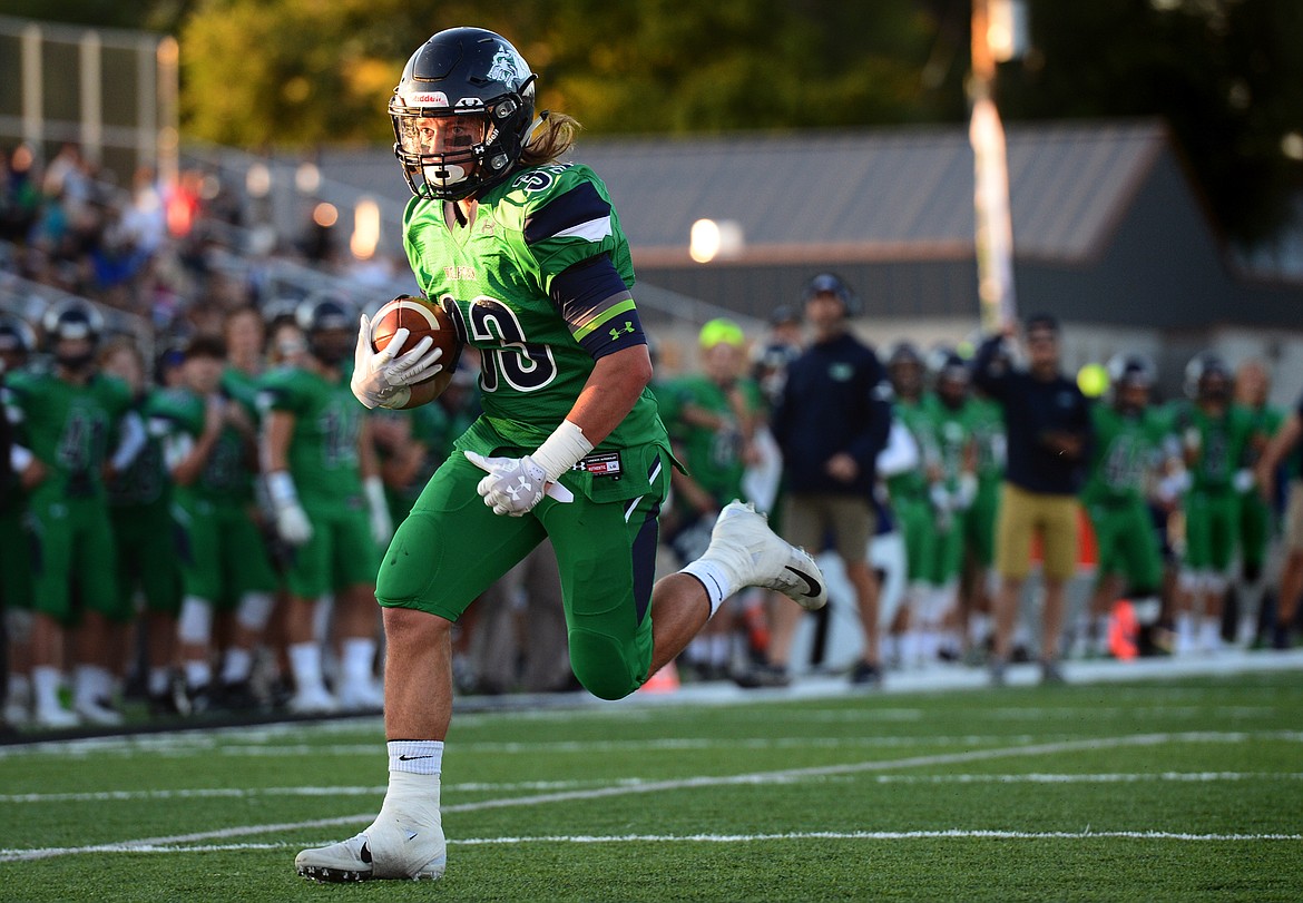 Glacier running back Preston Blain (33) heads to the end zone on a two-point conversion after the Wolfpack&#146;s first touchdown against Helena at Legends Stadium on Friday. (Casey Kreider/Daily Inter Lake)