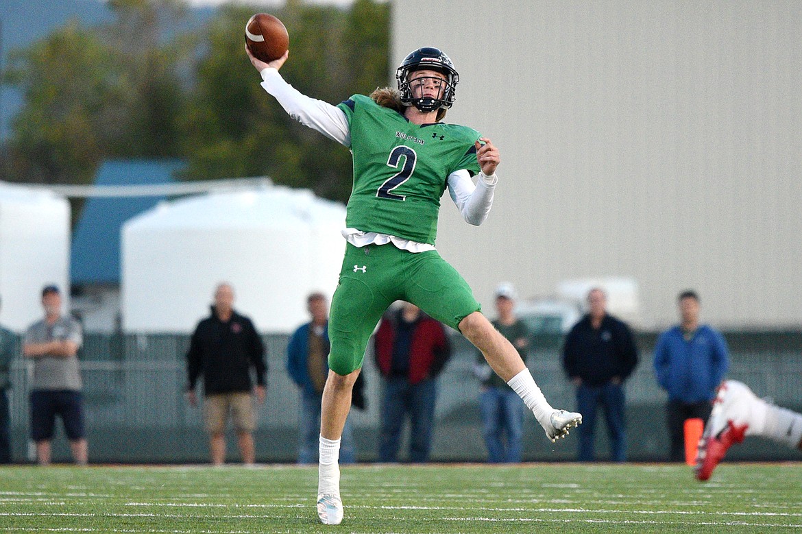 Glacier quarterback Evan Todd throws a long completion down field to wide receiver Drew Deck in the second quarter against Helena at Legends Stadium on Friday. (Casey Kreider/Daily Inter Lake)