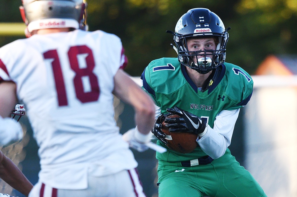 Glacier wide receiver Colin Bowden (1) runs after a first quarter reception against Helena at Legends Stadium on Friday. (Casey Kreider/Daily Inter Lake)