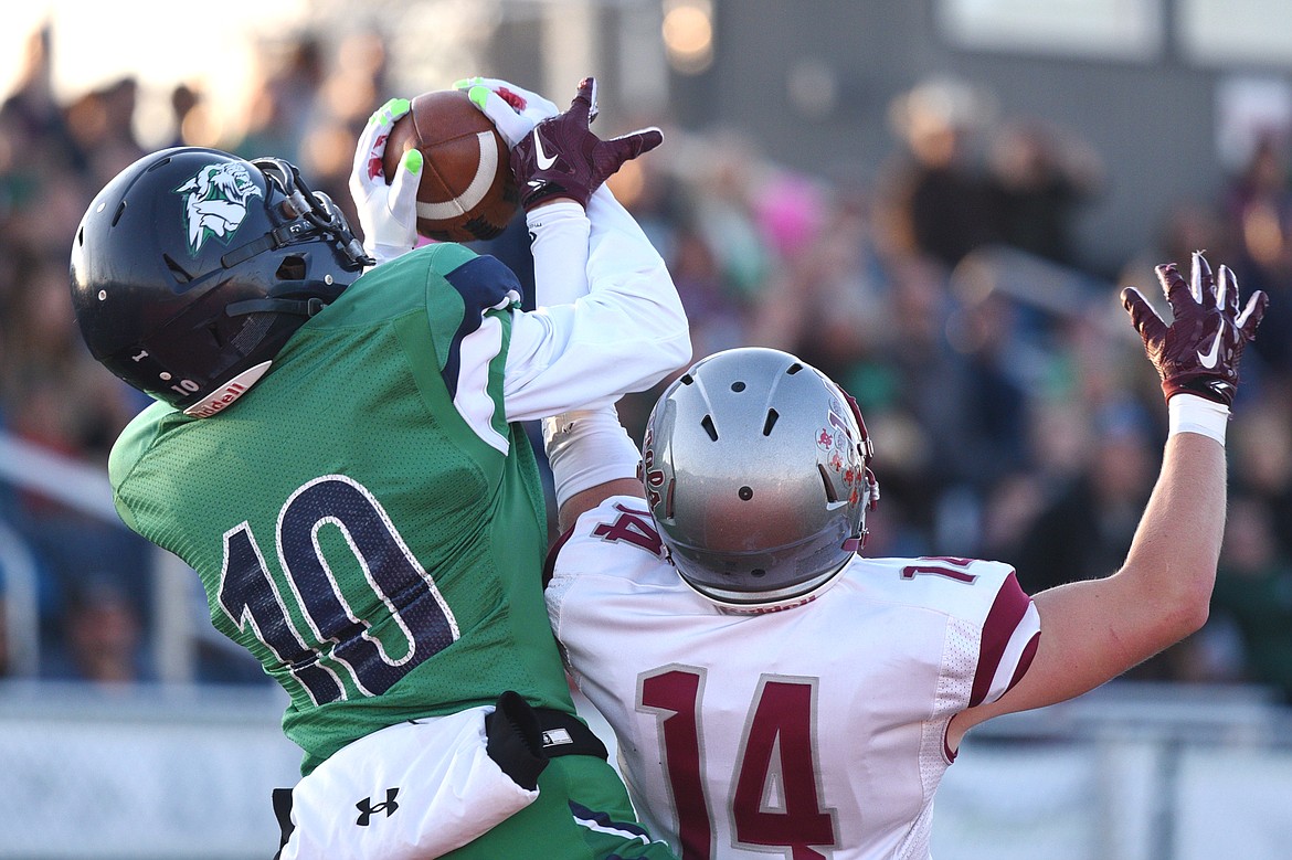 Glacier wide receiver Travis Proulx (10) hauls in a first quarter touchdown reception over Helena defensive back Zachary Spiroff (14) at Legends Stadium on Friday. (Casey Kreider/Daily Inter Lake)