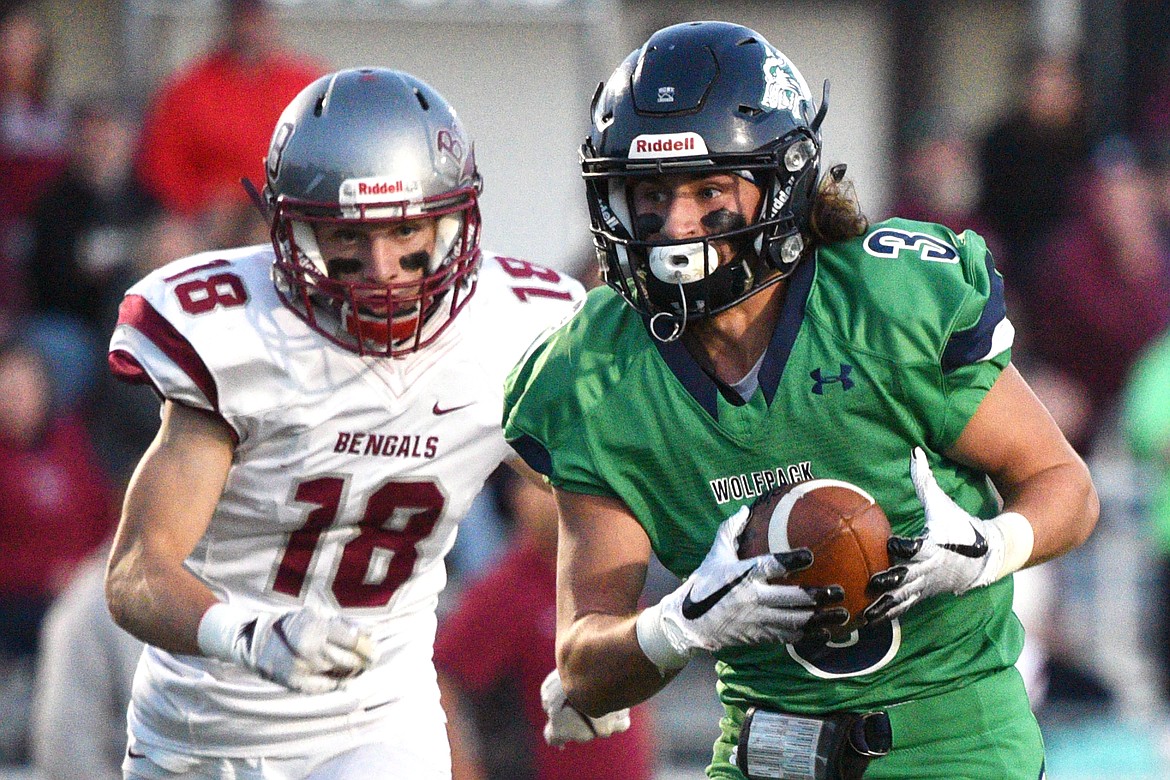 Glacier wide receiver Danny Anderson (3) hauls in a long touchdown reception in the second quarter in front of Helena defender Cooper Biegler (18) at Legends Stadium on Friday. (Casey Kreider/Daily Inter Lake)