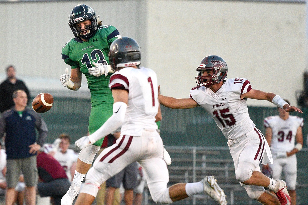 Glacier tight end Cole Crosby (13) can&#146;t bring in a reception in the second quarter with Helena&#146;s Connor Murgel (1) and Hayden Ferguson (15) defending at Legends Stadium on Friday. (Casey Kreider/Daily Inter Lake)