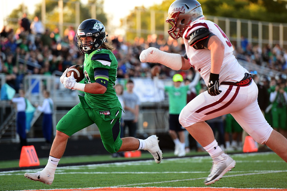 Glacier running back Preston Blain (33) heads into the end zone on a two-point conversion after the Wolfpack&#146;s first touchdown against Helena at Legends Stadium on Friday. (Casey Kreider/Daily Inter Lake)