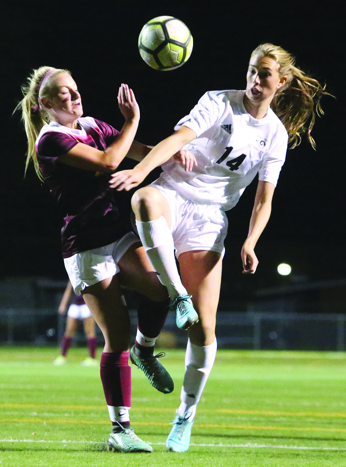 Connor Vanderweyst/Columbia Basin Herald
Moses Lake forward Madi Krogh (left) and West Valley's Halley Marschall battle for possession of the ball.