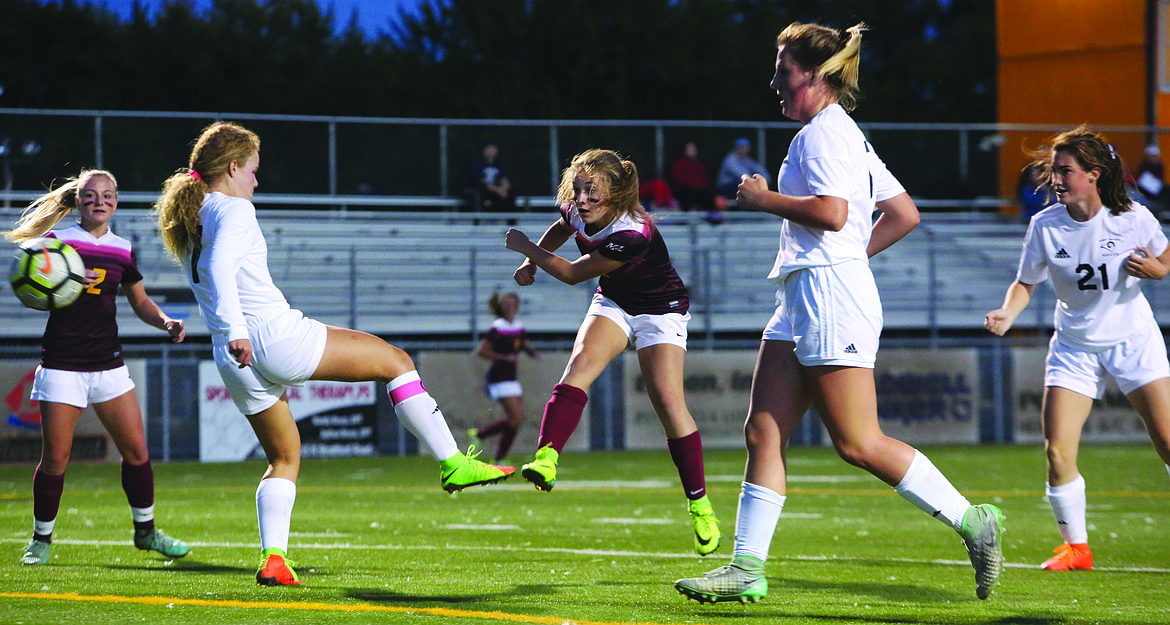 Connor Vanderweyst/Columbia Basin Herald
Moses Lake freshman Natalie Bunch (center) scores in the first half against West Valley.