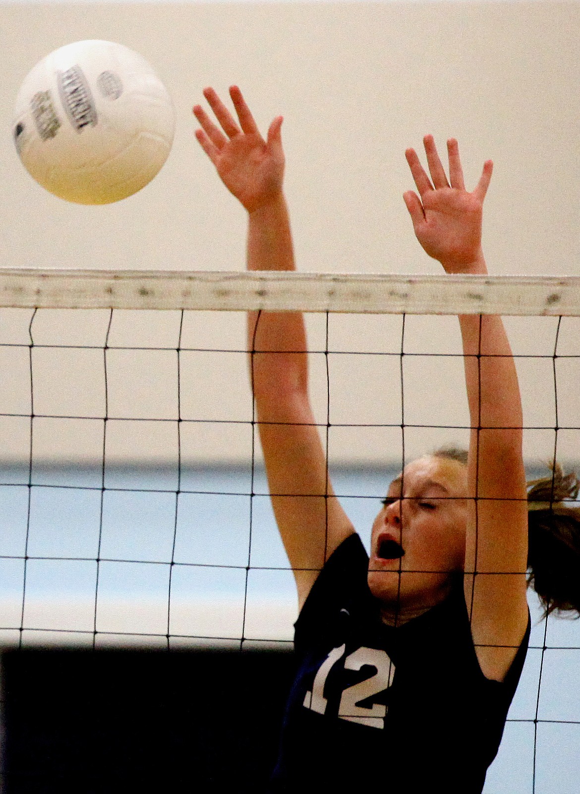 Rodney Harwood/Columbia Basin HeraldMoses Lake Christian's Maddie Schwab (12) goes up for a block during Thursday night's match with Wilson Creek.