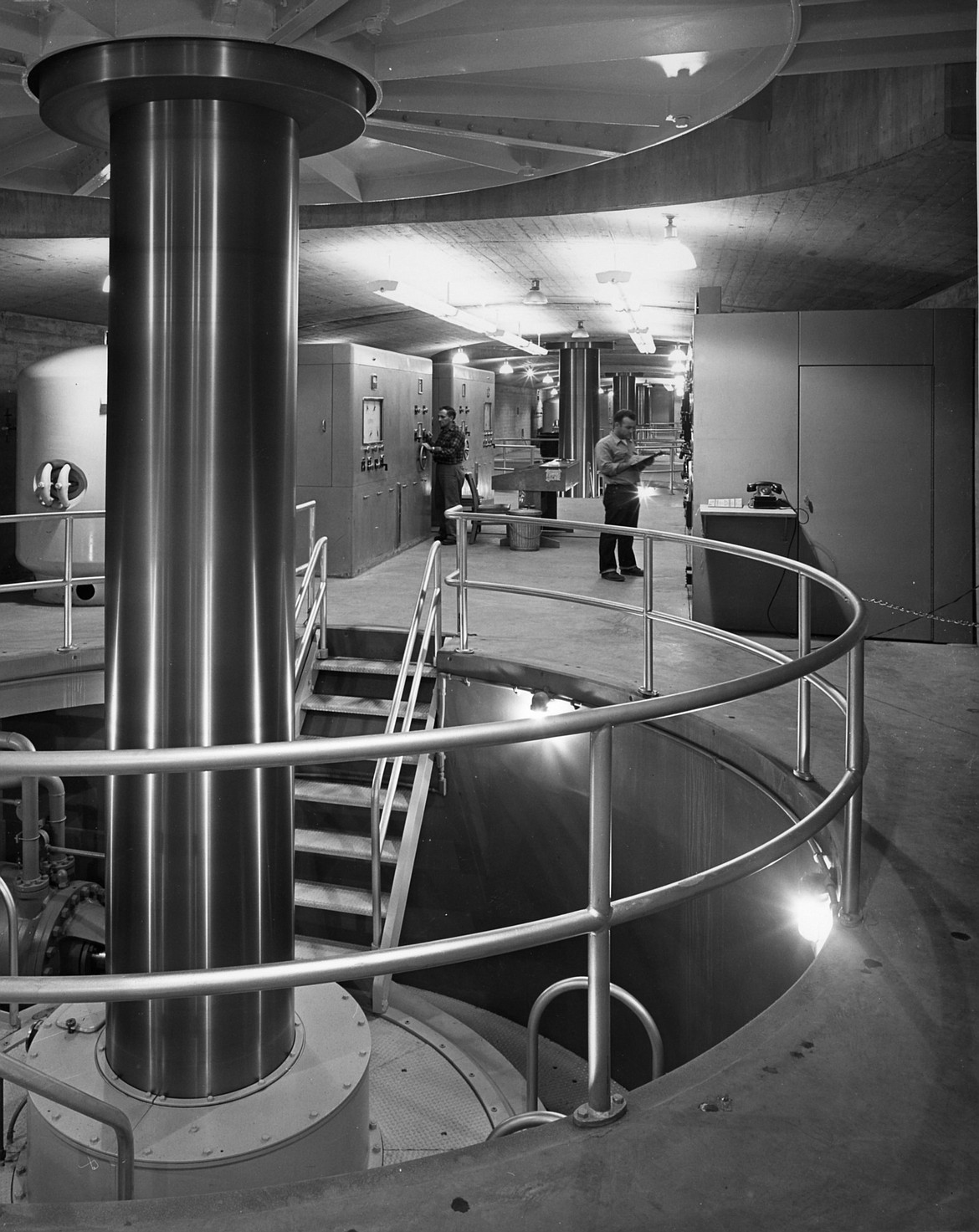 Seen here, in the turbine gallery of Hungry Horse Dam, is  the shaft of one of the four 105,000 horsepower turbines which drove the generators when the dam was completed. The huge steel shaft revolved at 180 revolutions per minute and was 34 inches in diameter with a six-inch bore. (1954 file photo by James Davis, Inter Lake photographer)