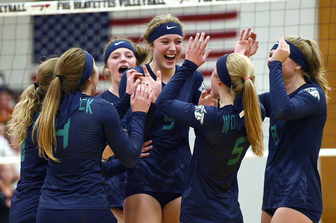 Glacier celebrates after winning the first match over Flathead during crosstown volleyball at Flathead High School on Thursday. (Casey Kreider/Daily Inter Lake)