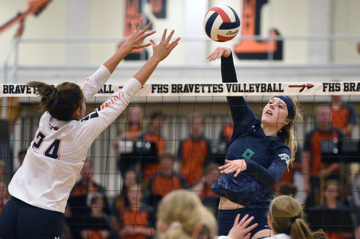 Glacier&#146;s Kali Gulick (9) goes for a kill against Flathead&#146;s Taylor Henley (24) during crosstown volleyball at Flathead High School on Thursday. (Casey Kreider/Daily Inter Lake)