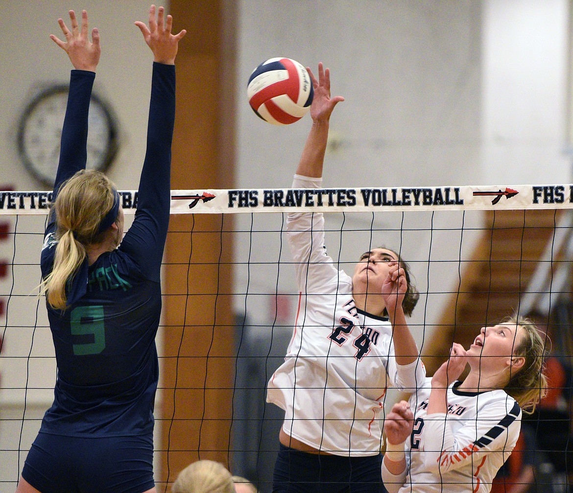 Flathead&#146;s Taylor Henley (24) goes for a kill with Glacier&#146;s Kali Gulick (9) defending during crosstown volleyball at Flathead High School on Thursday. (Casey Kreider/Daily Inter Lake)