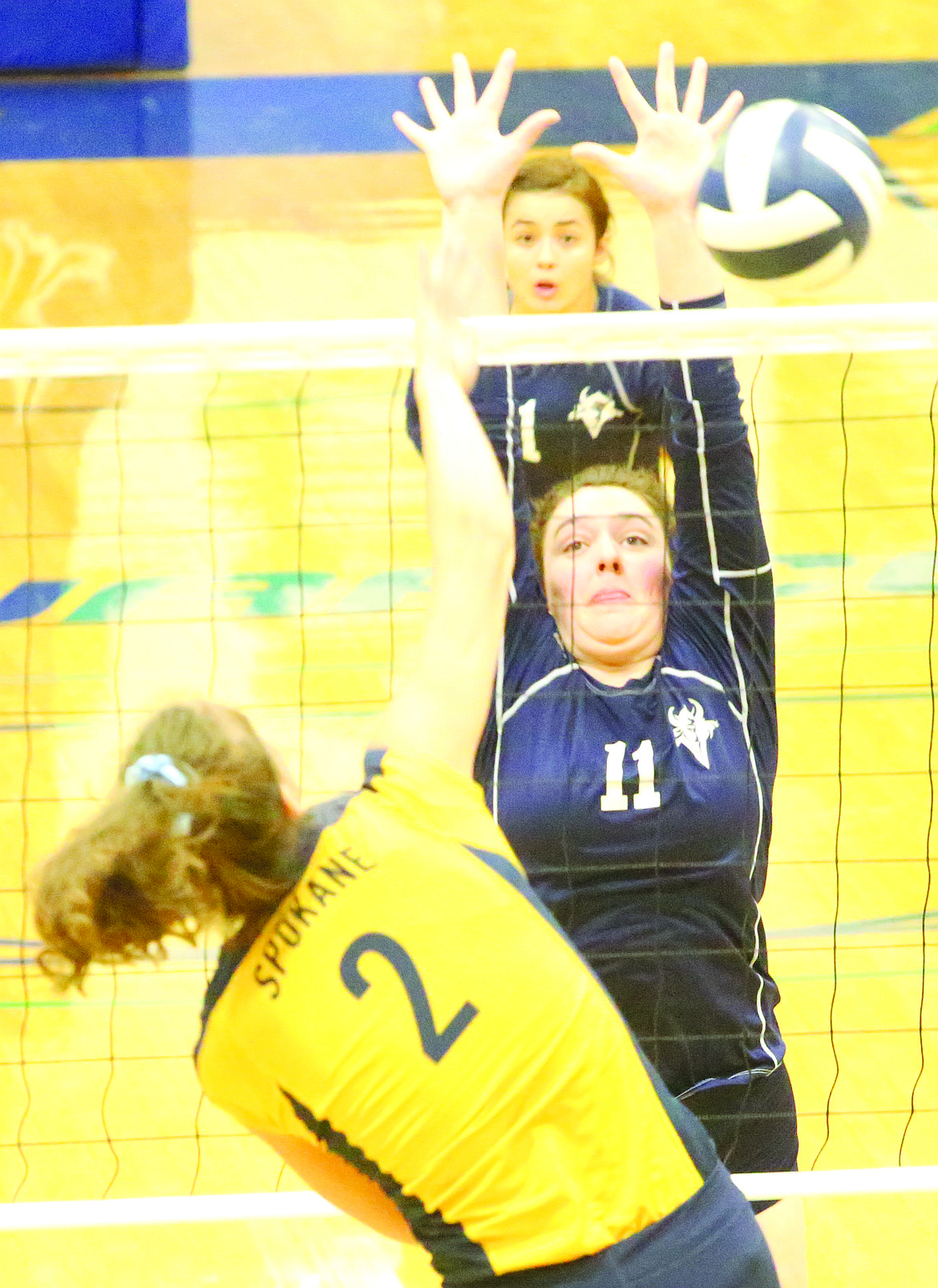 Connor Vanderweyst/Columbia Basin Herald
Big Bend middle Hannah Jolley (11) tries to block a spike by Spokane's Joelle Mahowald.