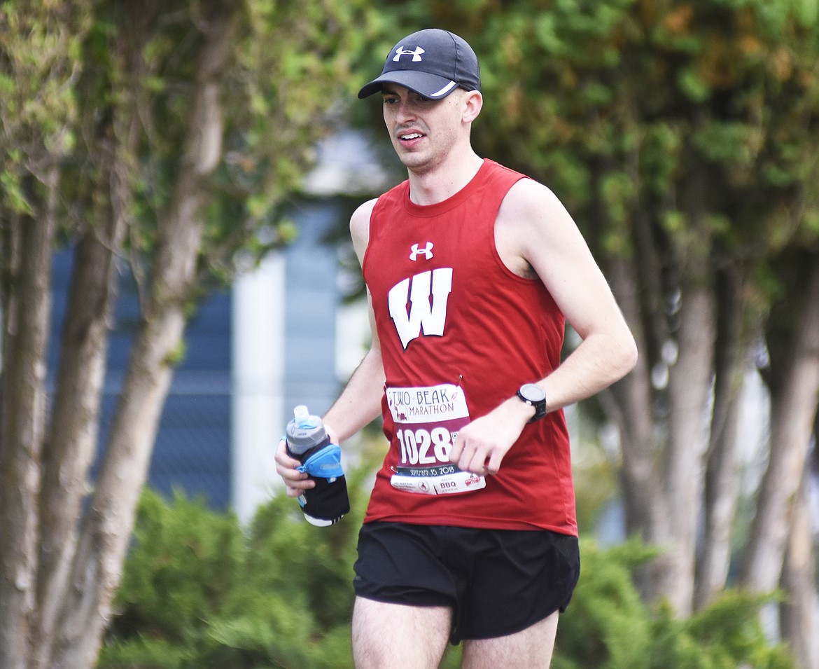 Wisconsin Badgers fan Andrew Kump competes in the Two Bear Marathon Sunday in Whitefish.