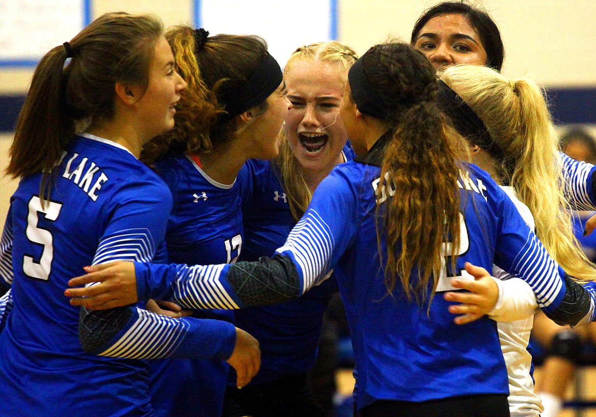 Rodney Harwood/Columbia Basin HeraldThe Soap Lake Eagles celebrate after making the score 24-24 in the third set of Tuesday night's nonleague match with Okanogan.