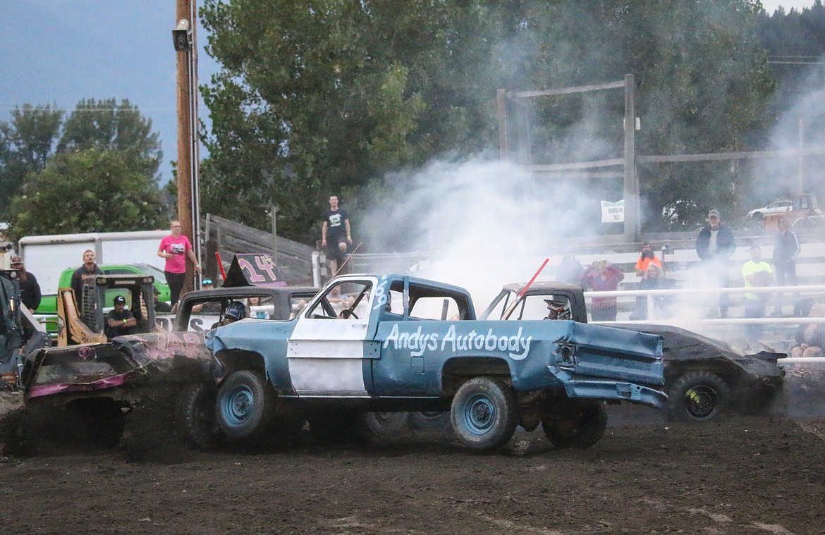 Photo by MANDI BATEMAN
Bryce Copeland puts a hit on Brandon Regehr during the truck class.