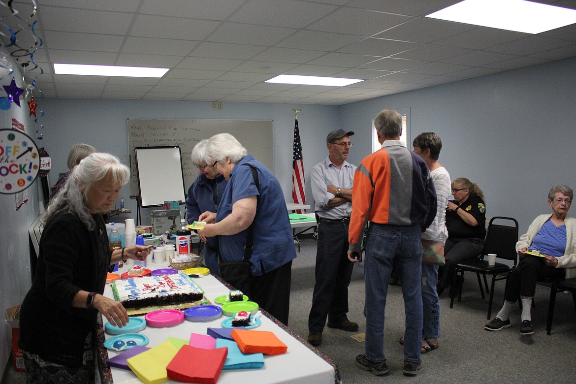 Roger visits with family, co-workers and friends during his retirement party on Sept. 13. He is retiring as Superior&#146;s Public Works Supervisor after 25 years of service.