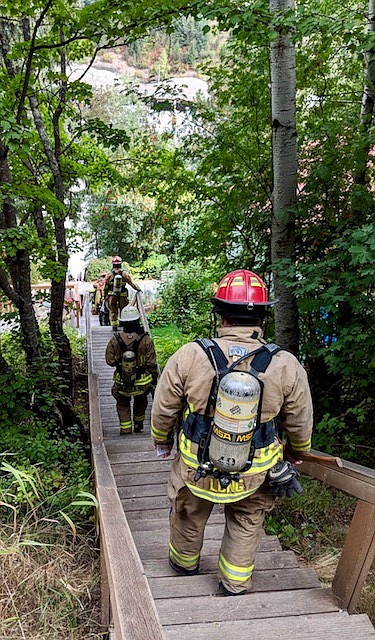 Fire crews make their way down the stairs after completing a cycle. Most firefighters who participated wore turnout gear to truly honor their fallen brothers and sisters.