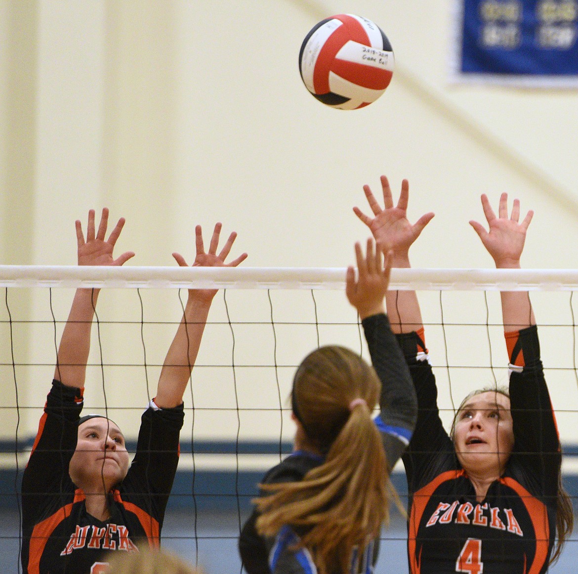 Stillwater Christian&#146;s Abigail Hudson (10) goes for a block of Eureka&#146;s Reena Truman (13) at Stillwater Christian School on Tuesday. (Casey Kreider/Daily Inter Lake)