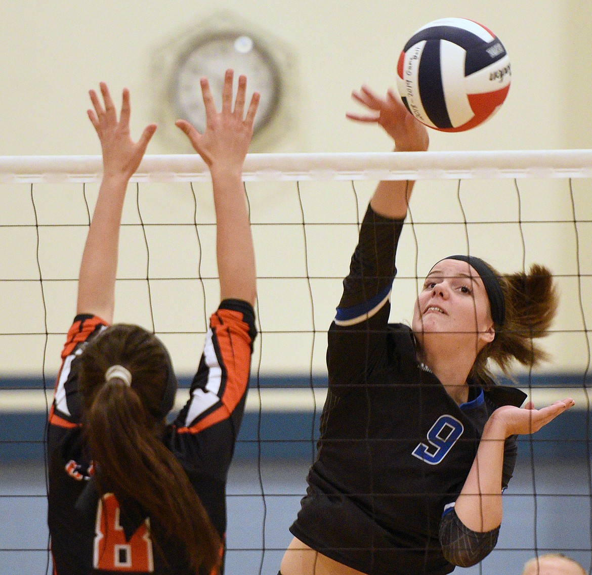 Stillwater Christian&#146;s Helen Hashley (9) looks for a kill past Eureka&#146;s Alyssa Utter (8) at Stillwater Christian School on Tuesday. (Casey Kreider/Daily Inter Lake)