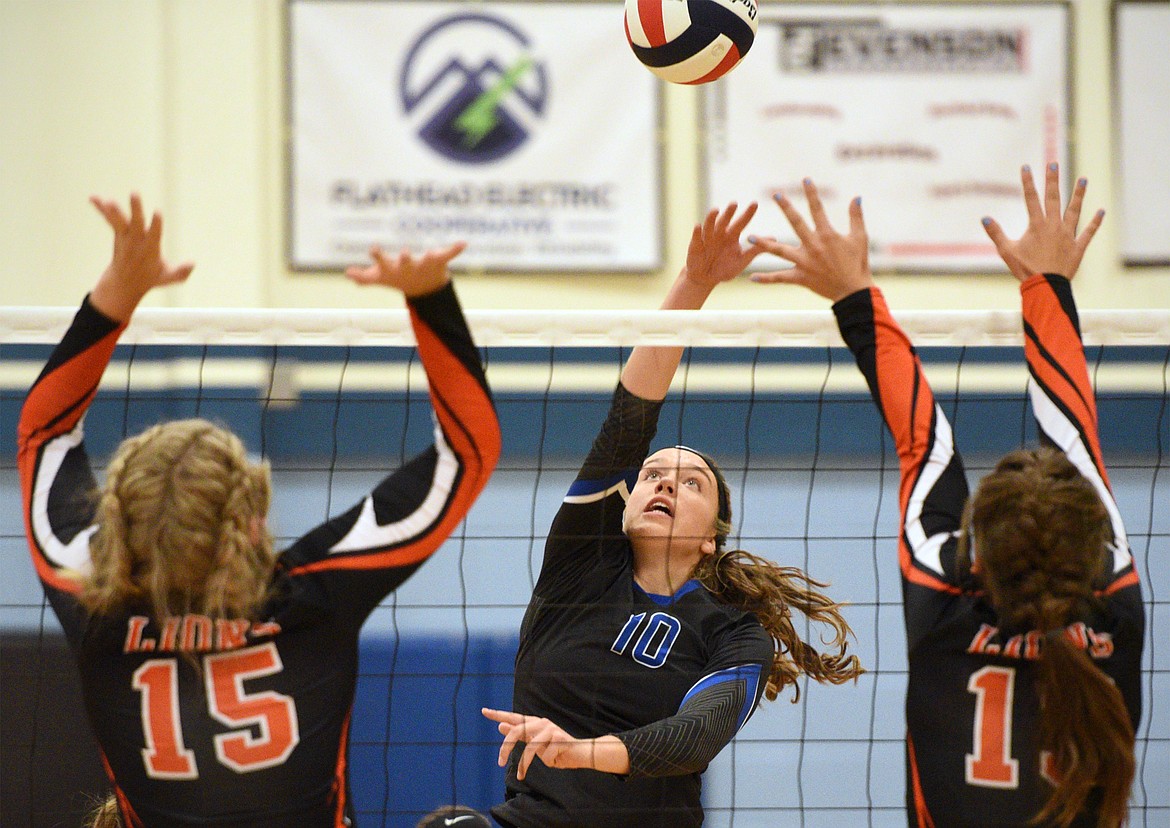 Stillwater Christian&#146;s Abigail Hudson (10) looks for a kill past Eureka&#146;s Maggie Graves (15) and Reena Truman (13) at Stillwater Christian School on Tuesday. (Casey Kreider/Daily Inter Lake)