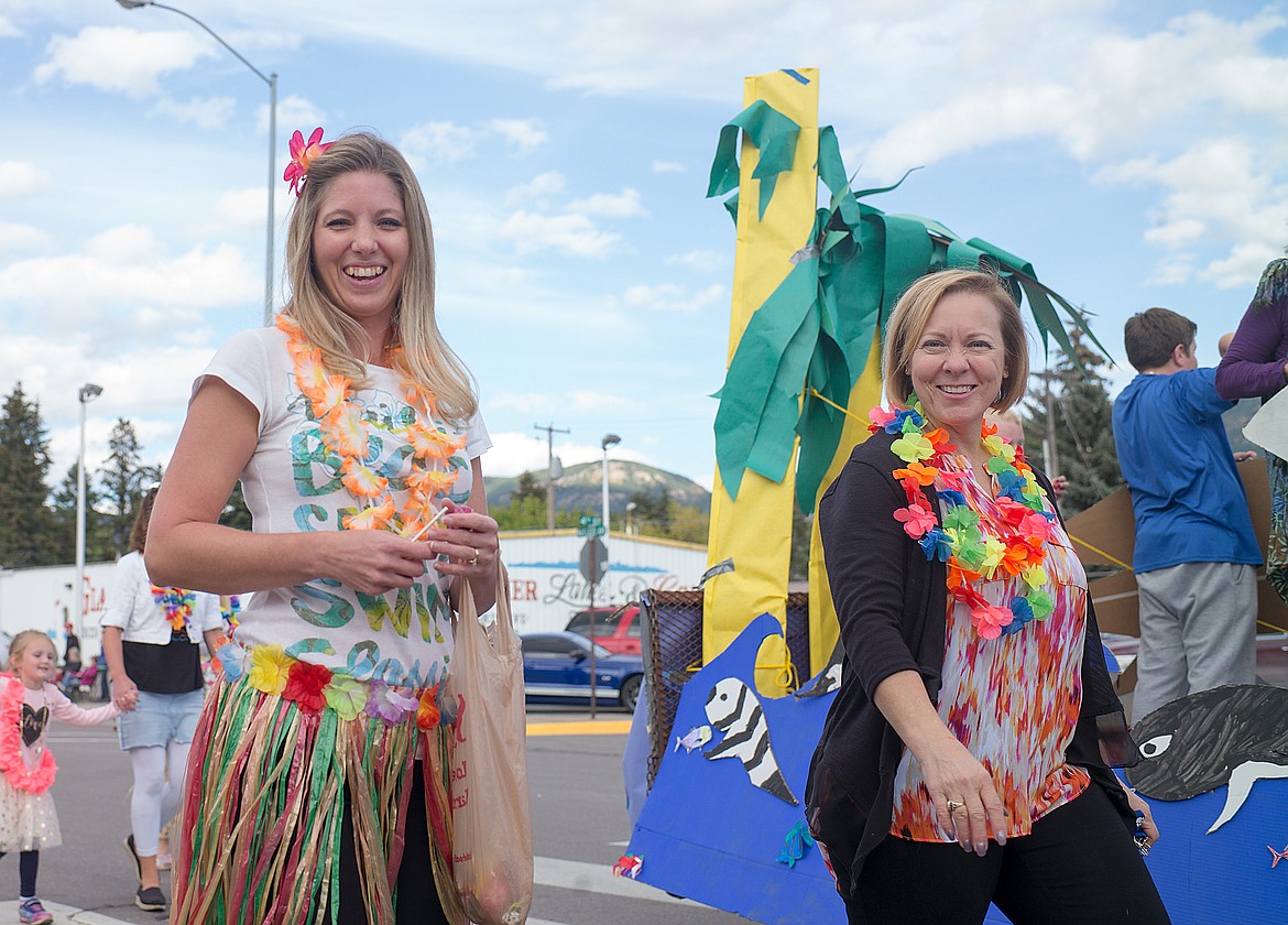 April Dyon, left, walks in the parade.