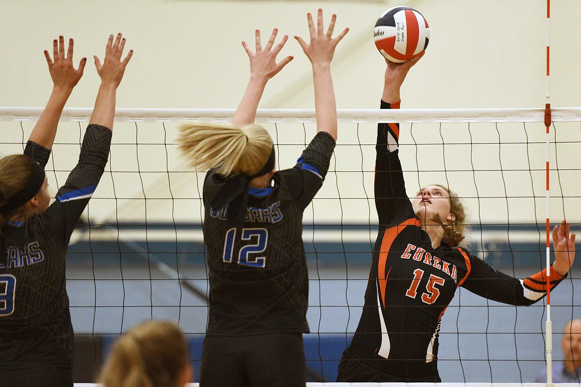 Eureka&#146;s Alyssa Utter (8) and Sienna Utter (4) go up for a block of Stillwater Christian&#146;s Madison Morken (4) at Stillwater Christian School on Tuesday. (Casey Kreider/Daily Inter Lake)