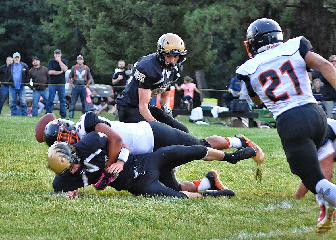 Horsemen defender Esvin Reyes puts a hard hit on a Seeley player, forcing a fumble during Plains' 36-6 victory Aug. 31. (Photo courtesy of Jessica Peterson)
