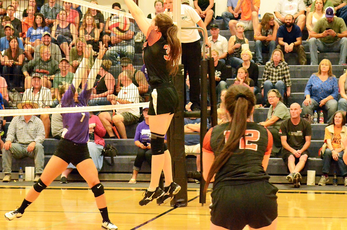 Trotter Rachel Huenink blocks Lady Viking Bella Hawk from pushing the ball over the net. (Erin Jusseaume/Clark Fork Valley Press)