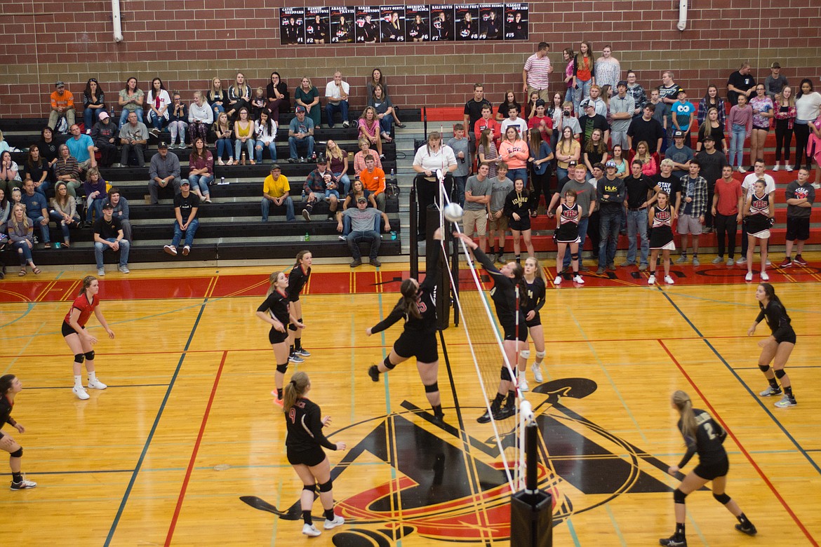 Photo by Jeff Green
Kellogg&#146;s Sam Bryant meets Wallace&#146;s Maggie Howard at net for a block during Kellogg&#146;s recent win over Wallace.