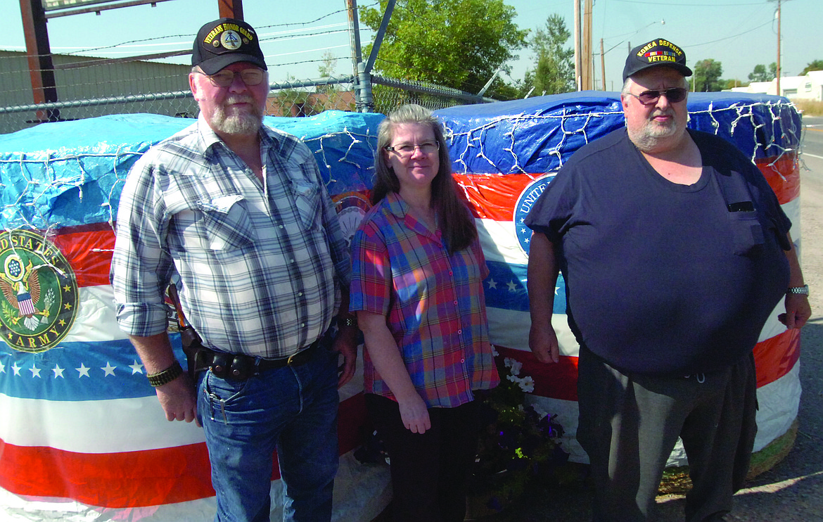 The Ronan American Legion and VFW Auxiliary teamed for a display in the Harvest Fest Trail of Bales in Ronan. Pictured, from left, are Glen Sharbono; Lorie Hoble, president of the Ronan VFW Auxiliary; and Penrod Davis. All three are members of the American Legion and VFW. (Joe Sova/Lake County Leader)