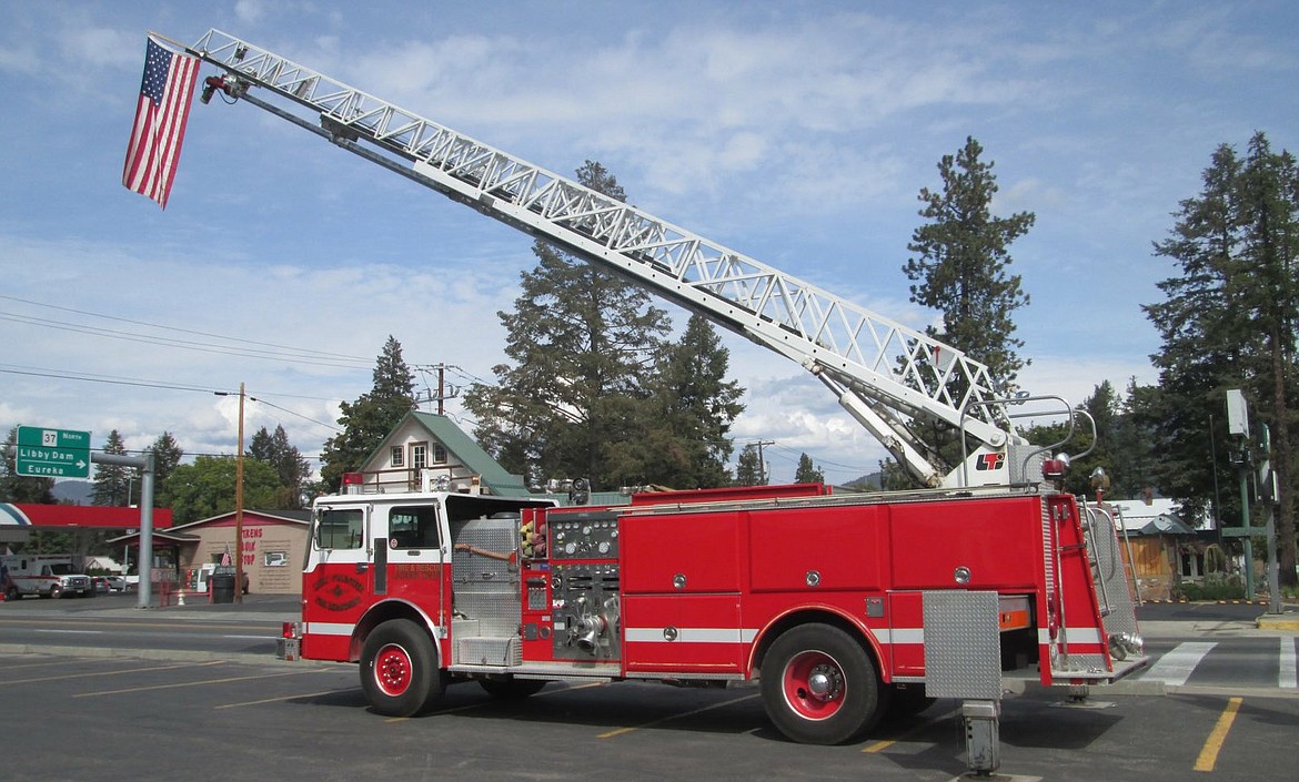 RIGHT: Libby Volunter Fire Department&#146;s ladder truck memorializes firefighters who lost their lives responding to the World Trade Center attacks on Sept. 11, 2001. (Sarah Farmer photo provided by Fire Chief Tom Wood)