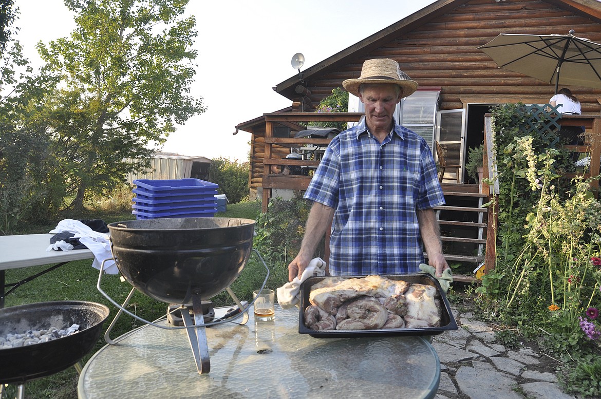 Will Tusick shows fresh lamb at the Farm to Table Feast, which he and wife Jan hosted at their Glenwood Farm last week. (Ashley Fox/Lake County Leader)