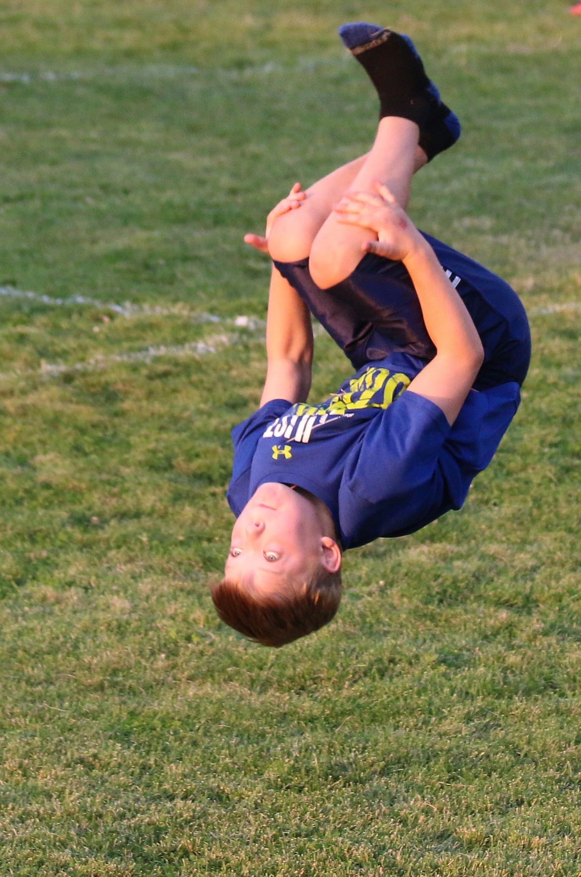 Photo by MANDI BATEMAN
Young fan flips for his favorite team, the Badger Boys Soccer!