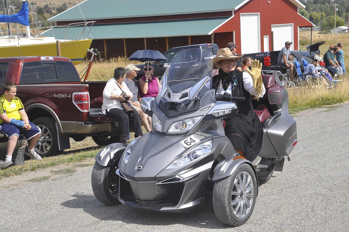 Christine Cook waves from a tricycle during the Dayton Daze parade Saturday, Sept. 8. Cook was a winner of the &#147;best costume&#148; contest. (Ashley Fox/Lake County Leader)