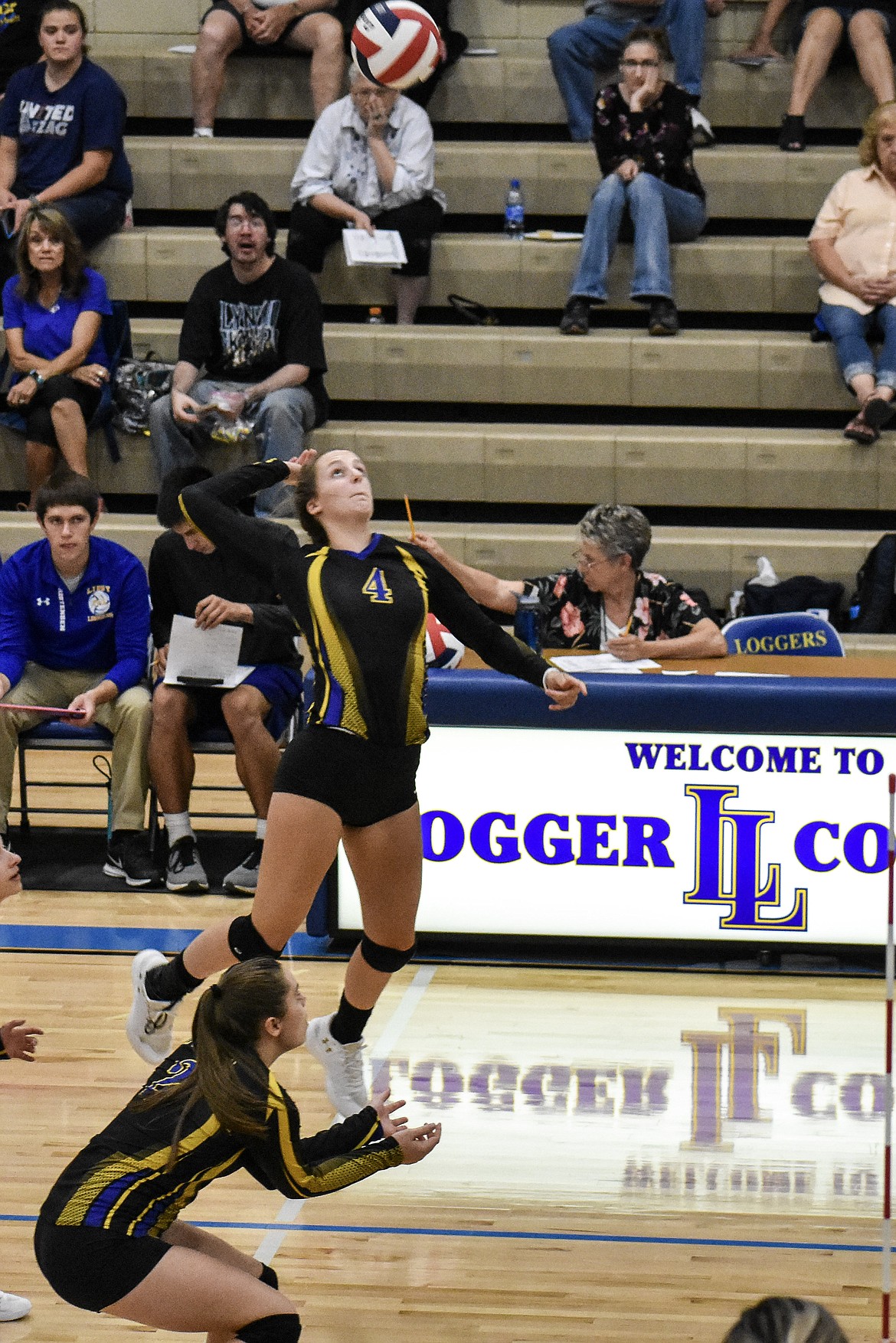 Libby senior Jayden Winslow prepares to score the first point of the match against Polson Saturday with a kill. (Ben Kibbey/The Western News)