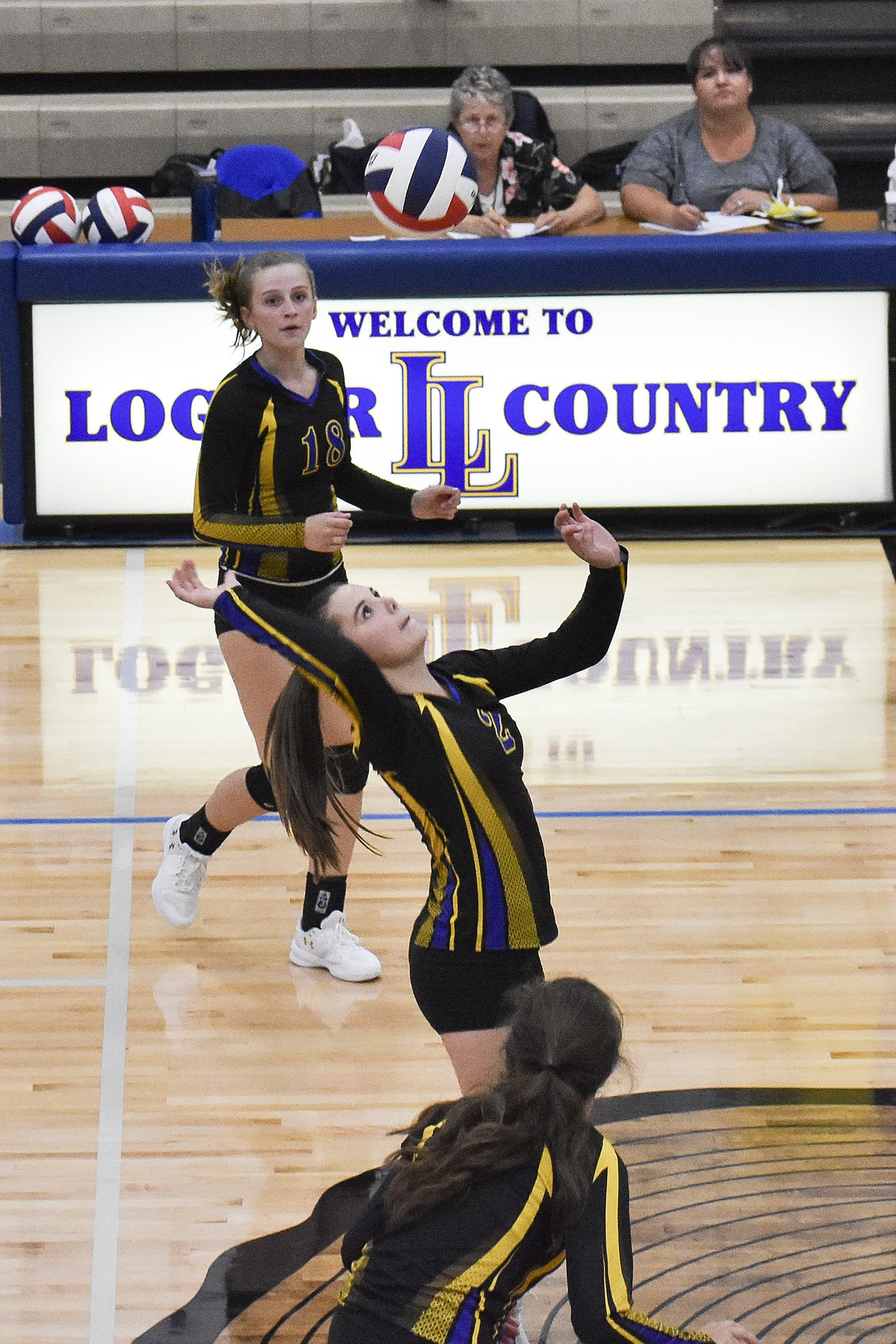 Libby junior Sheyla Gallagher comes up with a dig for the set-winning point during the first set against Polson Saturday. (Ben Kibbey/The Western News)