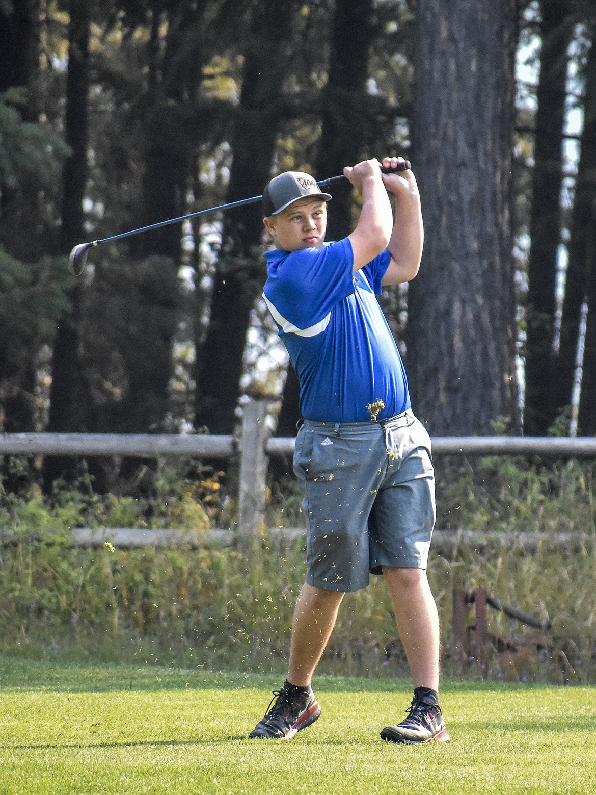 Libby senior Andrew Freese tees off on the fifth hole at Cabinet View Friday. (Ben Kibbey/The Western News)