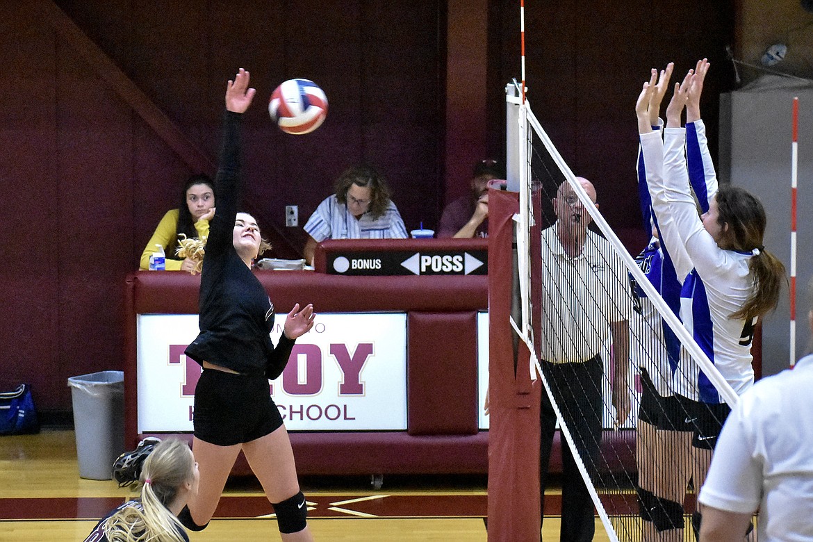 Troy junior Katelynn Tallmadge makes a kill early in the first set against Mission Saturday, bringing the score to 10-7, Mission. (Ben Kibbey/The Western News)