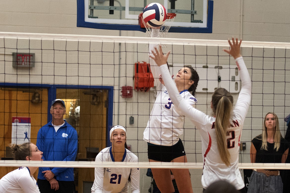 Wildkat outside hitter Stella Bistodeau goes up for a kill over Ronan&#146;s Brooklyn Kenelty Thursday. Bistodeau led the Wildkats with eight kills as they swept the Maidens. (Jeremy Weber photo)