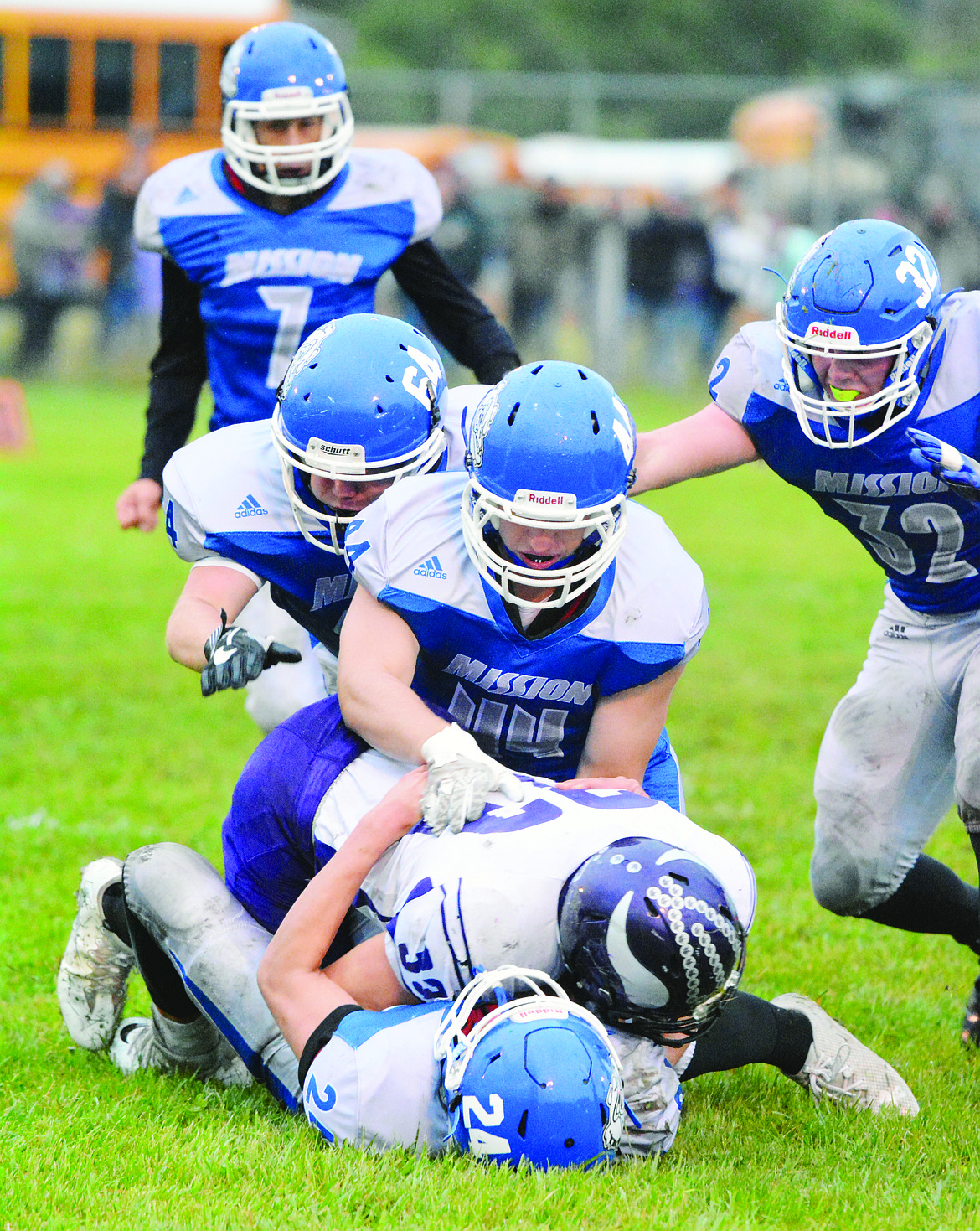 MISSION HIGH School Bulldogs attempt to gang tackle a Charlo ball carrier in last year&#146;s Sept. 15 conference game. The Bulldogs, now in their second year in Class C 8-man football, will attempt to defeat Charlo in an  early-season conference matchup with playoff implications at 7 p.m. Friday at Charlo High School. (Jason Blasco/Lake County Leader)