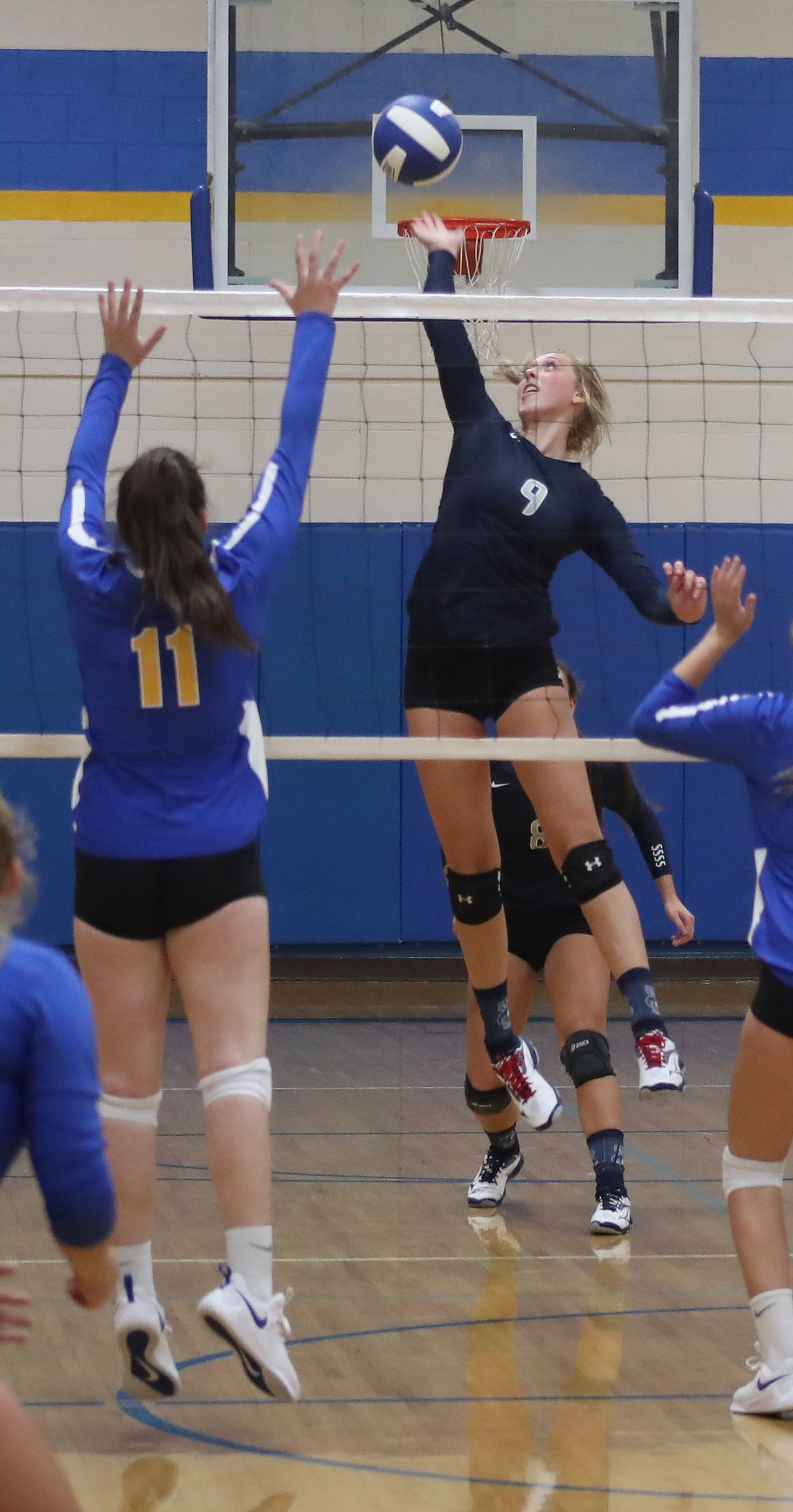 Photos by ERIC PLUMMER/Hagadone News Network
Bonners Ferry&#146;s Jerzie Pluid (9) jumps to spike the ball during the Badgers&#146; recent match at Clark Fork.

At right, BFHS player Grace Villelli keeps the ball in play