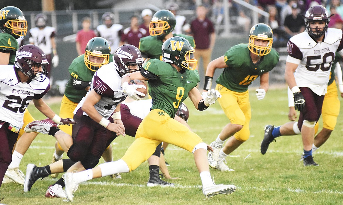 Josh Dudley races past Butte Central&#146;s defense during a 28-27 victory Friday night at Memorial Field. (Daniel McKay photos/Whitefish Pilot)