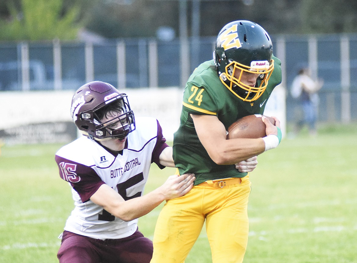 Devin Beale fights past a Butte Central defender during a 28-27 victory Friday night at Memorial Field.