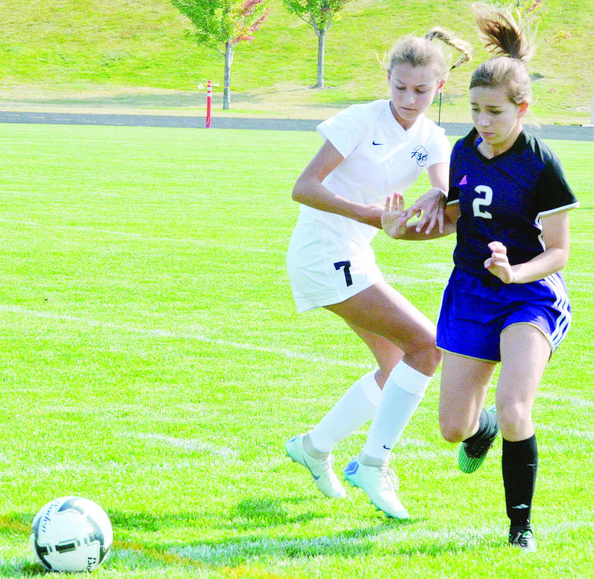 POLSON HIGH School player Autumn Bulrand (2) positions herself to secure and move the ball upfield in their 6-0 loss to Billings Central Friday afternoon at Polson High School Stadium. (Jason Blasco/Lake County Leader)